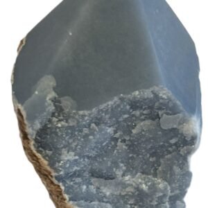 Natural rough angelite freeform with polished point 2 sians emporium Natural rough angelite freeform crystal with unpolished sides and a smooth polished blue point standing on a white background